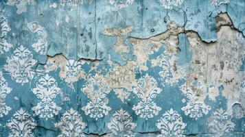 Old blue and white painted wall with a damask pattern photo