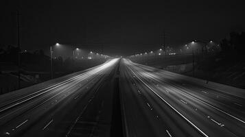 A freeway at night with traffic lights photo