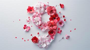 The number 9 made of red and white flowers photo