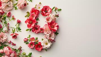The number 9 is made of flowers on a white background photo
