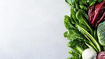 Fresh Green Vegetables Leafy Greens Chard Broccoli and Radicchio on White Background photo