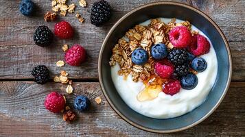 Delicious Yogurt Parfait with Granola Berries and Honey Healthy Breakfast Bowl photo