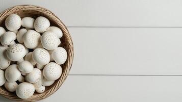 Fresh White Button Mushrooms in a Wicker Basket on White Wooden Background photo