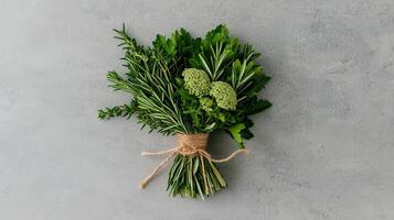 Fresh Herb Bouquet Rosemary Thyme Parsley Culinary Herbs Tied with Twine on Grey Background photo