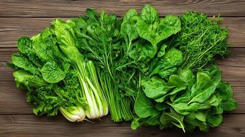 Fresh Green Leafy Vegetables Assortment on Rustic Wood Background Healthy Eating Concept photo