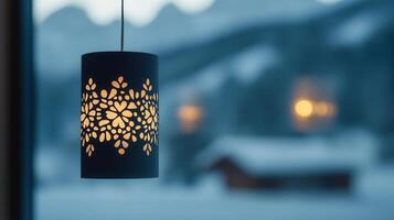 Elegant Snowflake Patterned Hanging Lamp Illuminates Winter Scene photo