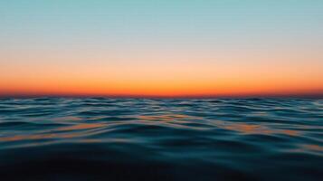 Serene Ocean Sunset Tranquil Water Reflecting Vibrant Sky Colors at Dusk photo