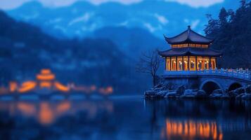 Illuminated Chinese Pavilion on a Tranquil Lake at Dusk Serene Asian Landscape photo