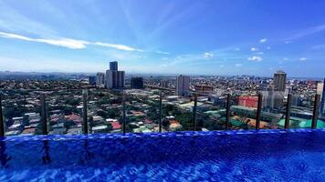 Sweeping views of Manila city from the rooftop pool on a clear day. video