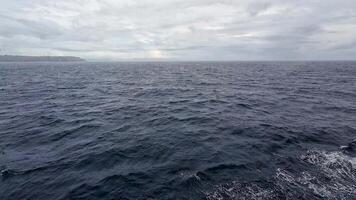 Ferry journey through turbulent seas with stormy clouds overhead. video