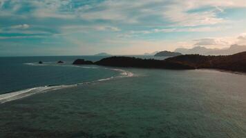 Drone image of breathtaking tropical shores and cliffs in Asia at golden hour video
