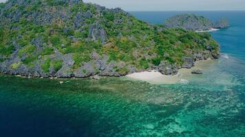 Breathtaking aerial view of pristine beaches with turquoise waters and rugged shorelines under clear skies. video