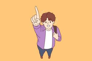 Happy college student pointing finger up and smiling, holding backpack on shoulder vector