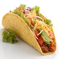 A taco filled with colorful ingredients lettuce, tomato, and shredded cheese., isolated on a white background photo