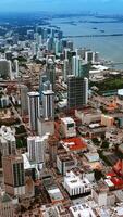 Vast scenery of Miami cityscape with multiple piers on the water. Wide array of architecture in the modern USA city. Vertical video