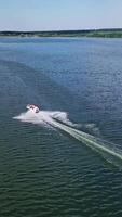 Boat floating on the river. Aerial drone view of small motor boat floating on river video