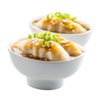 Steaming dumplings with savory sauce and green onions in a white bowl png