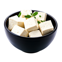 Fresh Cubes of Tofu in a Black Bowl with Green Leaves on the Side png