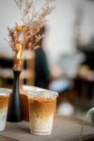 Glass of iced coffee in coffee shop, copy space and isolate concept. photo