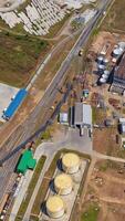 Construction of new granary on field. Abandoned industrial territory. Building new grain elevators. Aerial view. Vertical video