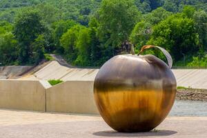 Maykop Russia - 01 June 2024 Bronze apple sculpture as symbol of town photo