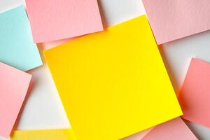 Flat lay of colorful notes with yellow mockup note photo