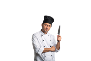 A chef in a white jacket and black hat, holding a knife upright with an intense and focused expression png