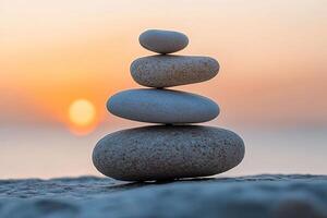 Smooth balanced stones are stacked in a pyramid on a cliff with a beautiful sea sunset in the background. Generated by artificial intelligence photo