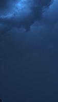 Dark storm clouds before rain. Light in the dark and dramatic storm clouds background video