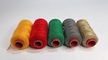 sewing thread roll isolated on white background photo