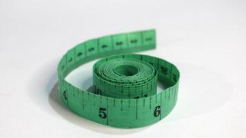 Tailor measuring tape on white background photo