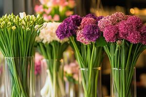 Vibrant Flower Arrangements Displayed in Clear Vases at a Floral Shop in the Afternoon Light photo
