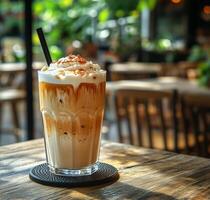 Enjoying a Refreshing Iced Coffee in a Cozy Caf Setting With Natural Light photo