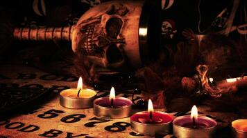 Creepy Skull on a Witchcraft Ouija Board and Candles 11 photo