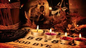 Creepy Skull on a Witchcraft Ouija Board and Candles 17 photo