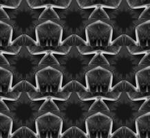 Monochrome geometric pattern with repeating star-like motifs. Dark gray and white tones creating a high contrast design. Symmetrical arrangement with a tessellated effect. Intricate details. vector