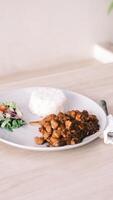 chicken fried rice with salad on white plate photo