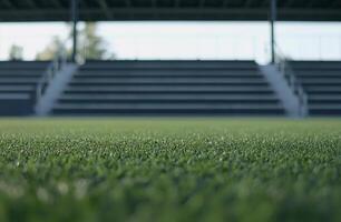 A panoramic view of a football field with bright green turf and white boundary lines. The wide-open space is perfect for sports-themed visuals, teamwork concepts, and dynamic action shots photo
