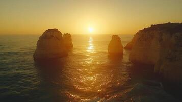 Sunset over ocean rocks. photo