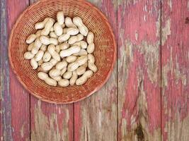 Peanuts in a basket on a wooden table video