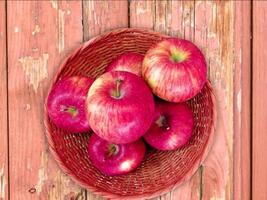 A basket of red apples on a wooden table video