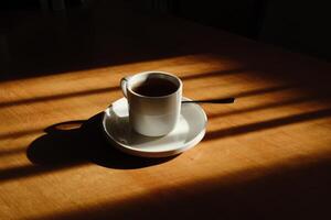 Enjoying cup of coffee in the soft morning light, highlighting beautiful shadows photo