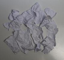 Scraps of paper divided into pieces on a white background. White paper. photo