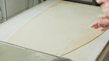 Kneading dough at a local bakery in the early morning for fresh pastries and bread preparation video