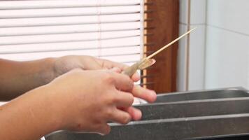 Preparing fresh shrimp for grilling at home in a cozy kitchen setting video