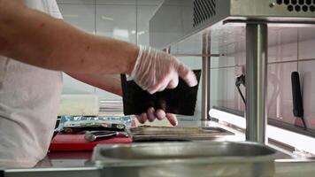 Preparing fresh ingredients in a bustling kitchen environment during lunch preparation video