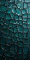 A high-resolution close-up of teal crocodile scales, emphasizing their smooth shine and decorative patterns. photo