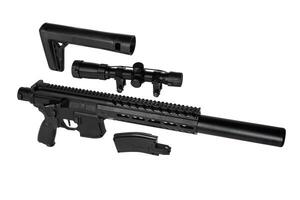 Disassembled air rifle with a scope, stock, and magazine, isolated on a white background. photo