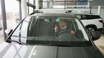 Happy Man Celebrating and Dancing in His New Car video