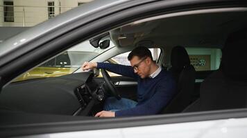 Man Examines New Right-Hand Drive Car Before Purchase video